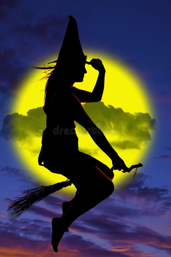 Silhouette of witch on broom