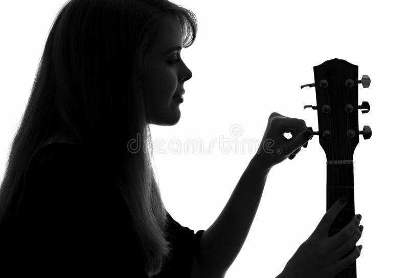 Silhouette of a woman configure a guitar stock photos Silhouette of a woman configure a guitar stock photos