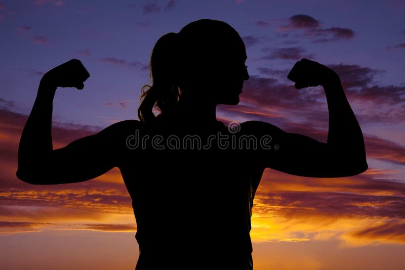 Silhouette of woman fitness flex both arms close