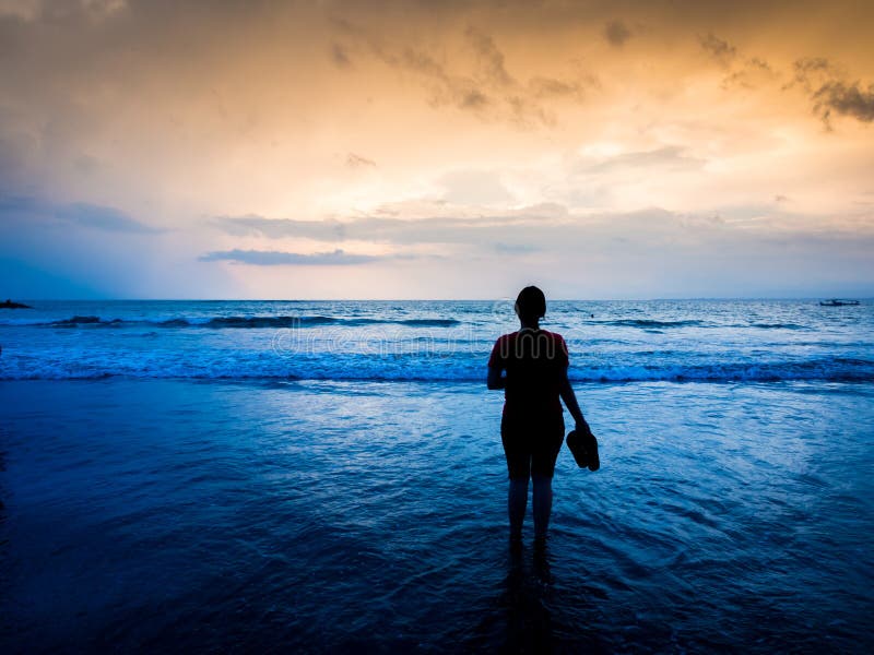 Silhouette of woman holding slippers stock images Silhouette of woman holding slippers stock images