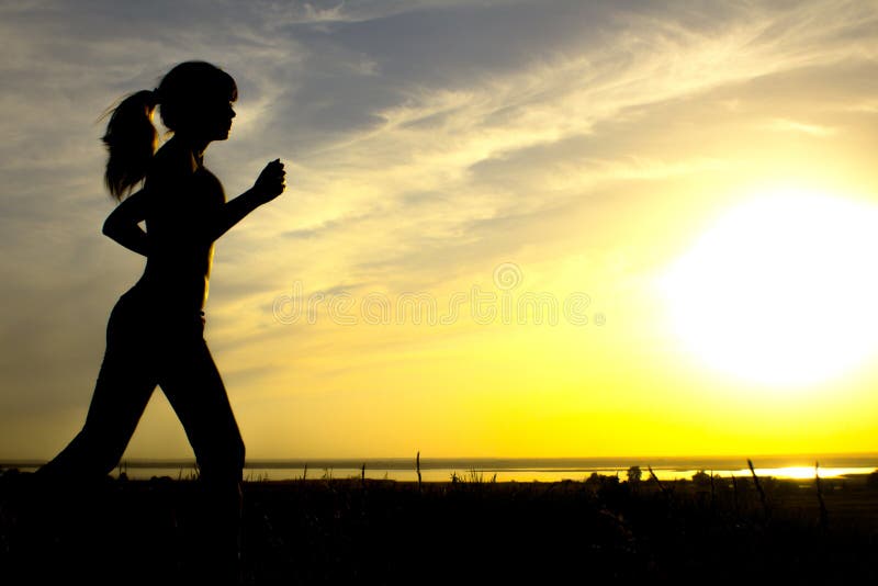 Silhouette of a woman jogging on nature at sunset, sports female profile, concept of sport, leisure and healthcare stock photos Silhouette of a woman jogging on nature at sunset, sports female profile, concept of sport, leisure and healthcare stock photos