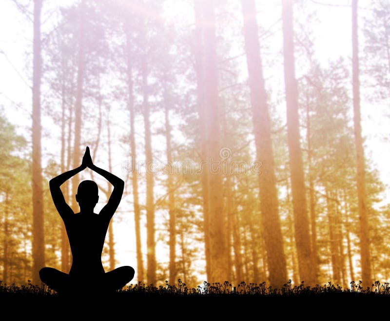 Silhouette of a woman meditating in the forest