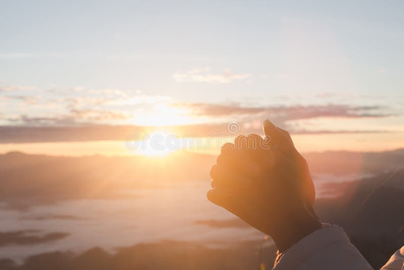 Silhouette of woman praying over beautiful sunrise background - Image