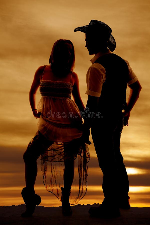 Silhouette woman skirt up man cowboy