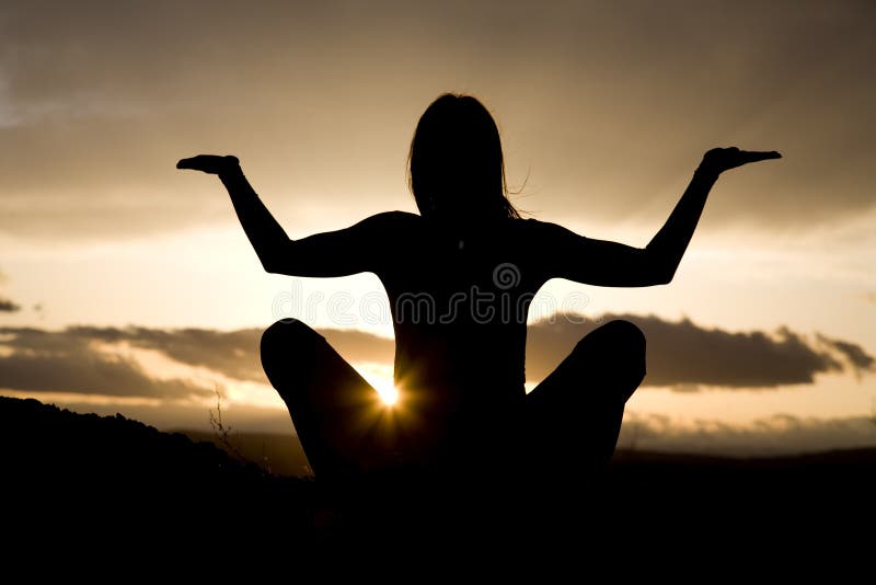 Silhouette yoga sitting