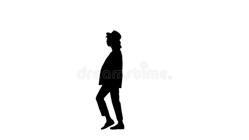 Silhouette Young black lady wearing a hat walking.