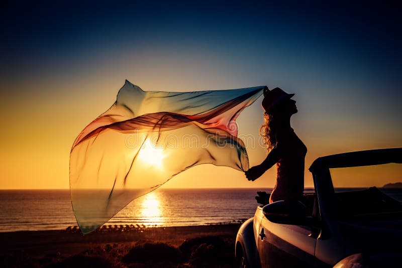 Silhouette of young woman at the beach