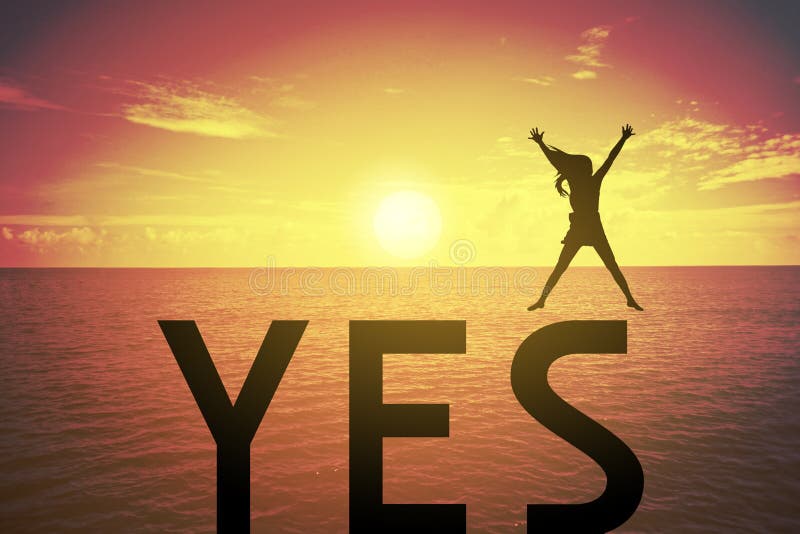 Silhouette young woman jumping and raising up her hand about happy concept on YES text over a beautiful sunset or sunrise stock photography Silhouette young woman jumping and raising up her hand about happy concept on YES text over a beautiful sunset or sunrise stock photography