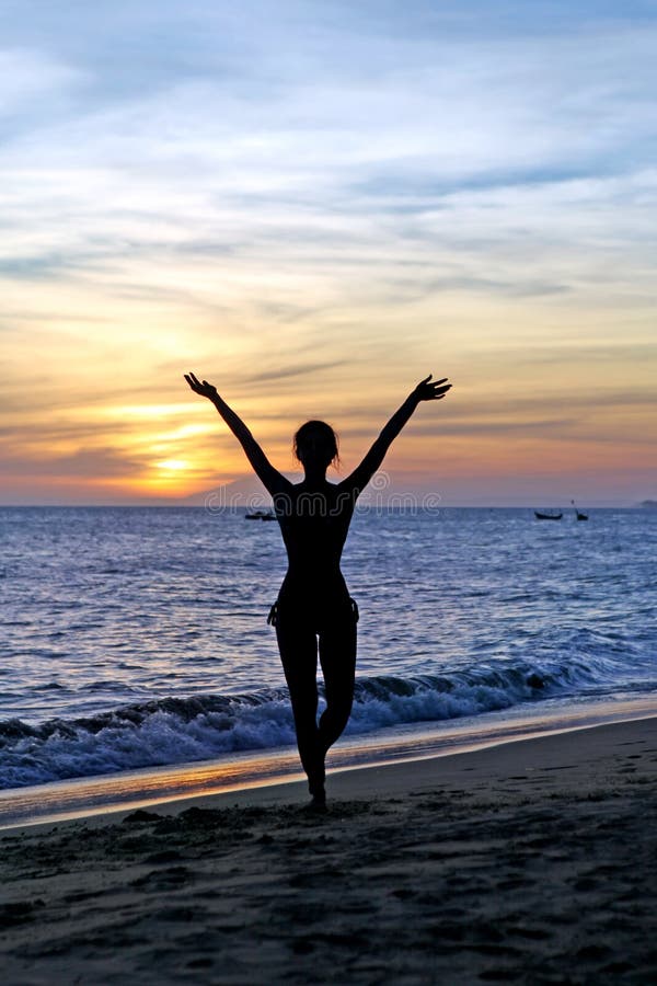Silhouette young woman on sunset royalty free stock photos