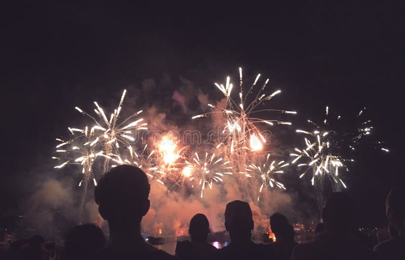 Silhouetted People Watching a Fireworks Display royalty free stock images