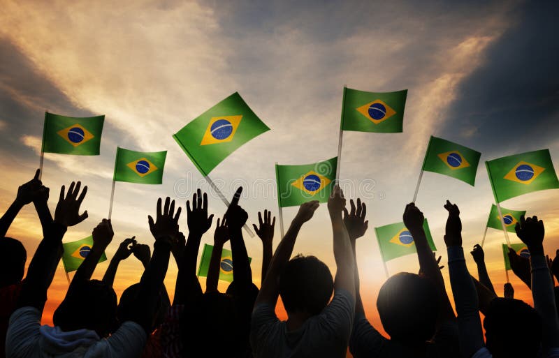 Silhouettes of People Holding the Flag of Brazil. Silhouettes of People Holding the Flag of Brazil.