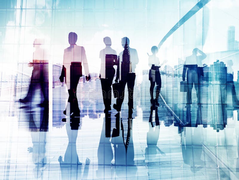 Silhouettes of Business People in Blurred Motion Walking stock image
