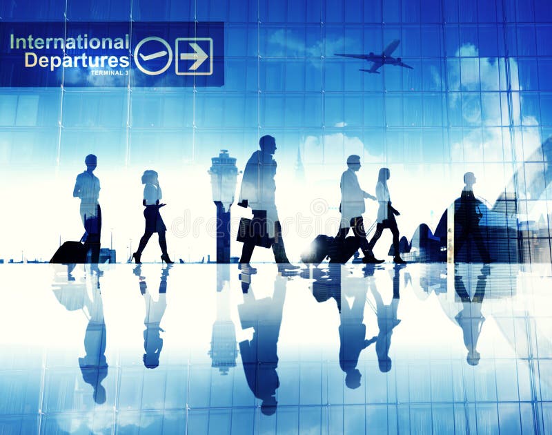 Silhouettes of Business People Walking in an Airport stock image Silhouettes of Business People Walking in an Airport stock image