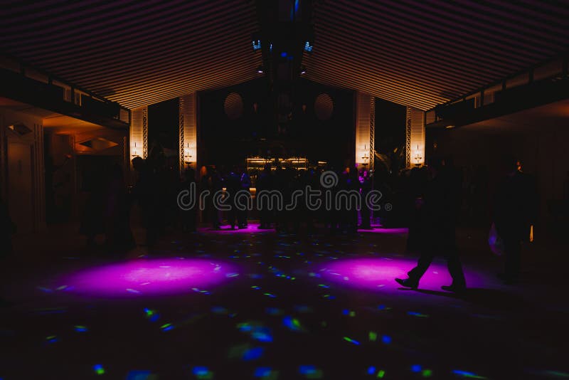 Silhouettes of concert crowd in front of bright stage lights. Disco and nightlife concept royalty free stock photo Silhouettes of concert crowd in front of bright stage lights. Disco and nightlife concept royalty free stock photo