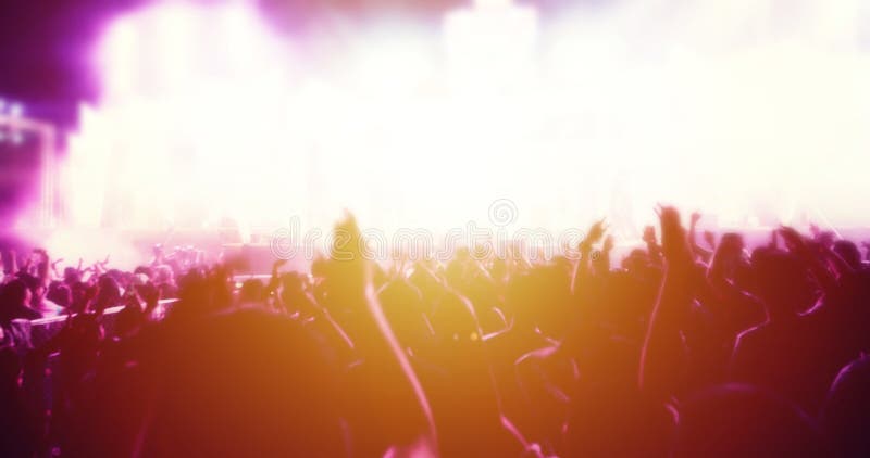 Silhouettes of Concert Crowd in Front of Bright Stage Lights with ...