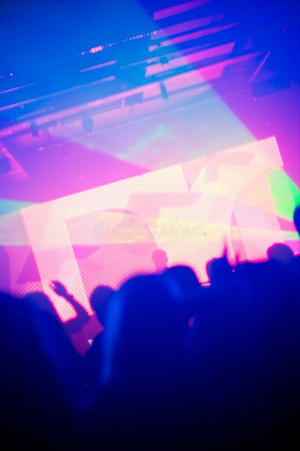 Silhouettes of dancing people in ultraviolet light stock photos Silhouettes of dancing people in ultraviolet light stock photos