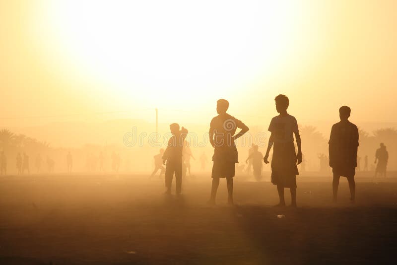 Kids silhouettes in the dusty sunset (Shibam, Yemen). Kids silhouettes in the dusty sunset (Shibam, Yemen)