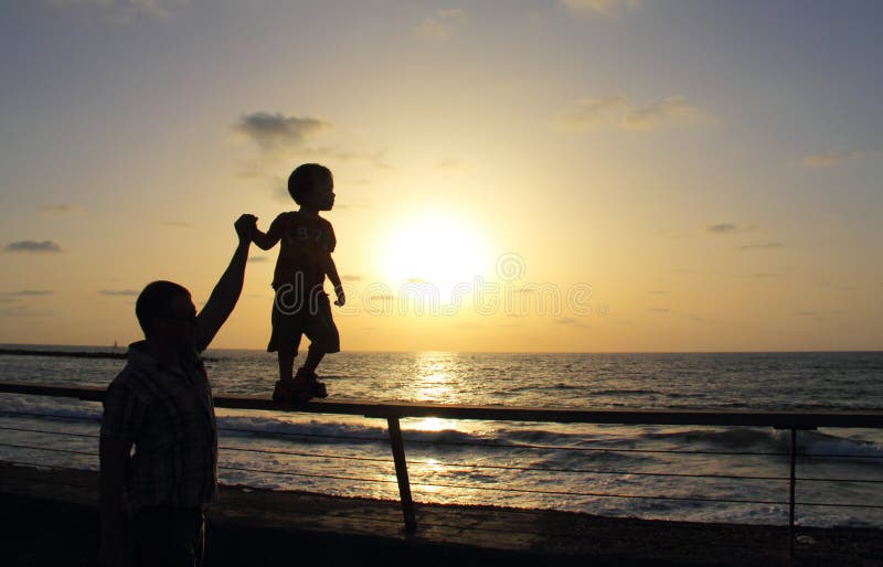 Silhouettes of father and son