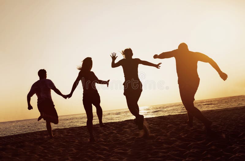 Silhouettes group friends peoples beach run sunset stock image Silhouettes group friends peoples beach run sunset stock image