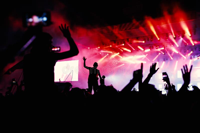 Silhouettes of Hands on Concert in Front of Bright Stage Lights Stock ...