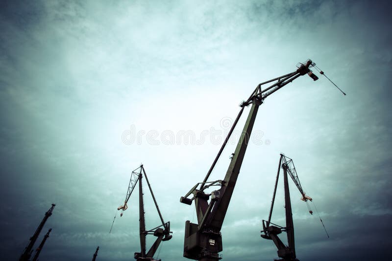 Silhouettes of industrial cranes in Gdansk shipyard