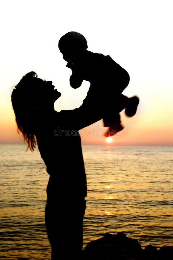 Silhouettes of mother and son