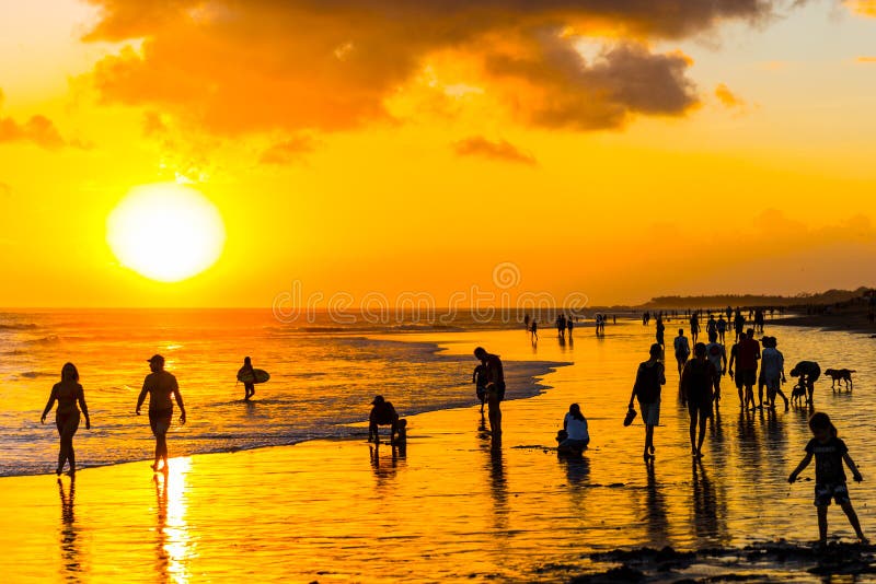 Silhouettes of people on a sunset background on the beach of Bali, Indonesia stock photos Silhouettes of people on a sunset background on the beach of Bali, Indonesia stock photos