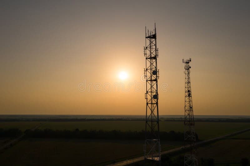 Silhouettes of telecommunication towers royalty free stock photos