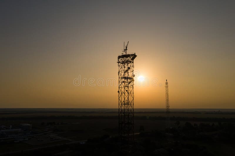 Silhouettes of telecommunication towers royalty free stock photo