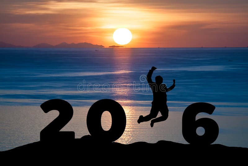 Silhouette young man jumping on the sea and 2016 years while celebrating new year with sunrise. Silhouette young man jumping on the sea and 2016 years while celebrating new year with sunrise