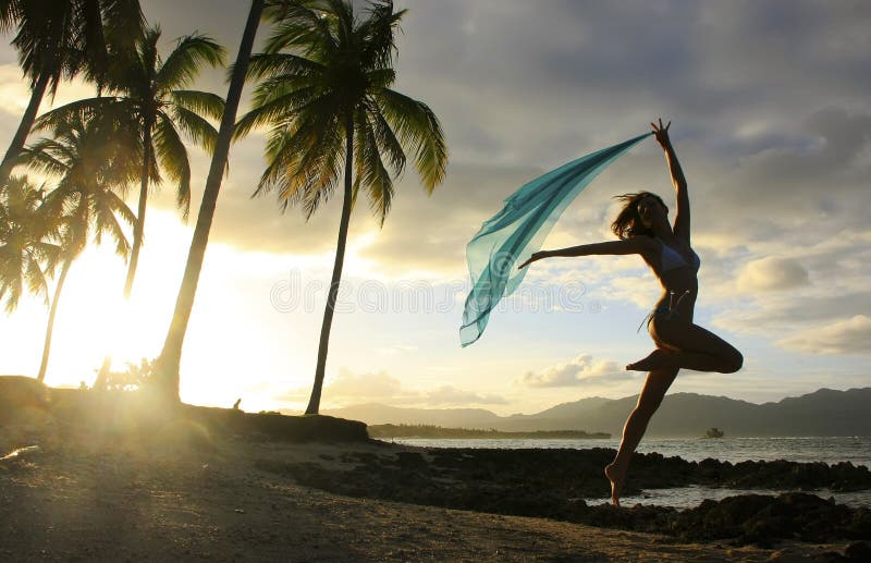 Silhouette of young woman jumping at Las Galeras beach, Samana peninsula, Dominican Republic. Silhouette of young woman jumping at Las Galeras beach, Samana peninsula, Dominican Republic