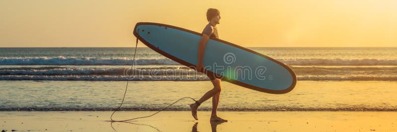 Vacation Silhouette Of A Surfer Carrying His Surf Board Home At Sunset With Copy Space. BANNER, long format. Vacation Silhouette Of A Surfer Carrying His Surf Board Home At Sunset With Copy Space. BANNER, long format