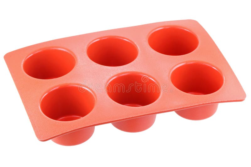 Red silicone mold to make muffin and cupcake, isolated on white