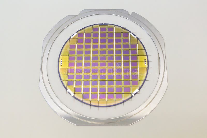 Silicon wafer with microchips fixed in the holder with steel frame on the grey background and ready for process. Silicon Wafers with microchips - used in electronics for the fabrication of integrated circuits. Color silicon wafers with glare semiconductor industry substrate technology close up devices disc electrical cleaning industrial macro micro-circuits photovoltaics printed slice polysilicon basic capacity crystalline development factory manufacturing microelectronic polycrystalline production nanoelectornics photolithography chuck