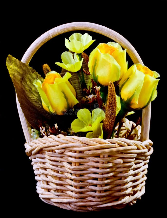 Silk flowers in wicker basket