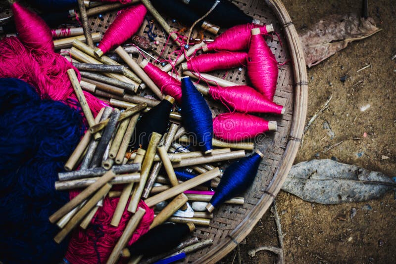 Silk thread in basket prepare to making Thai silk cloth stock photos