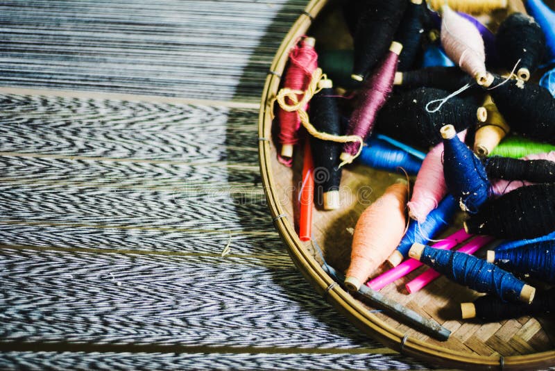 Silk thread in basket prepare to making Thai silk cloth royalty free stock image