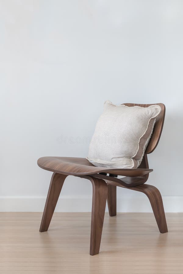 Wooden modern chair with pillow on wood floor. Wooden modern chair with pillow on wood floor