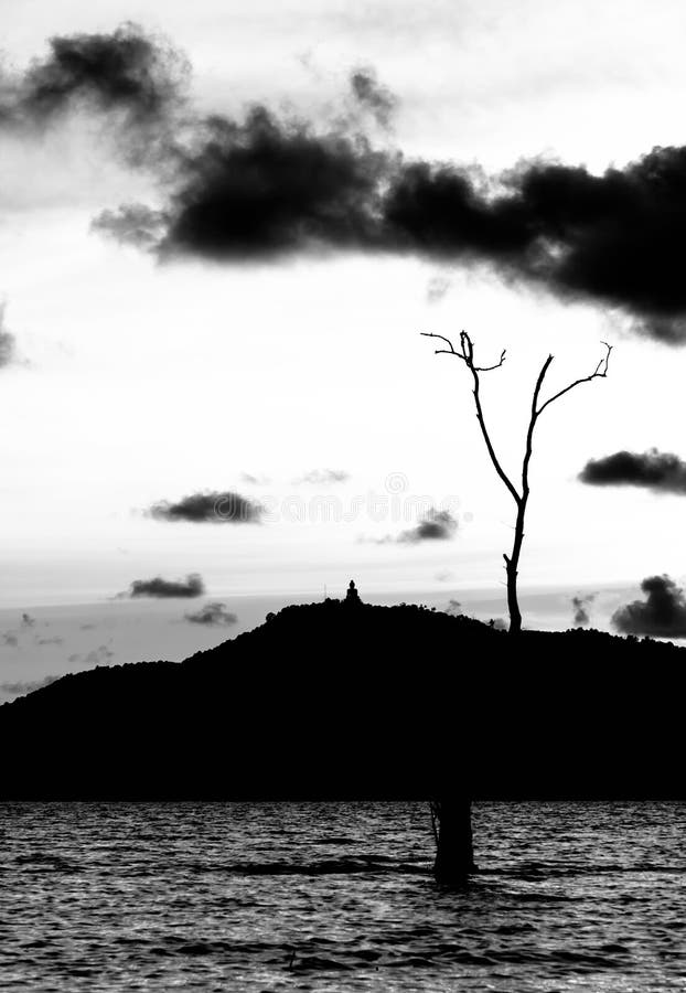 Sillohuette shadow buddha image,tree and mountain stock images