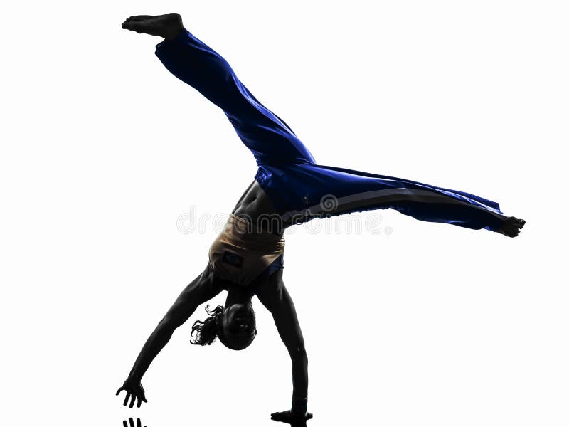 Silueta del baile del bailarín del capoeira de la mujer fotografía de archivo Silueta del baile del bailarín del capoeira de la mujer fotografía de archivo