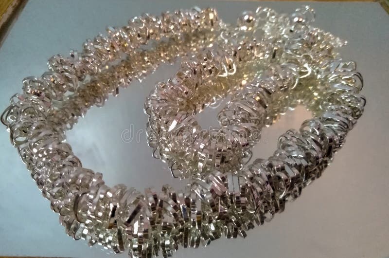Silver Chain Mail Link Necklace Jewelry on Mirror Surface Stock Image