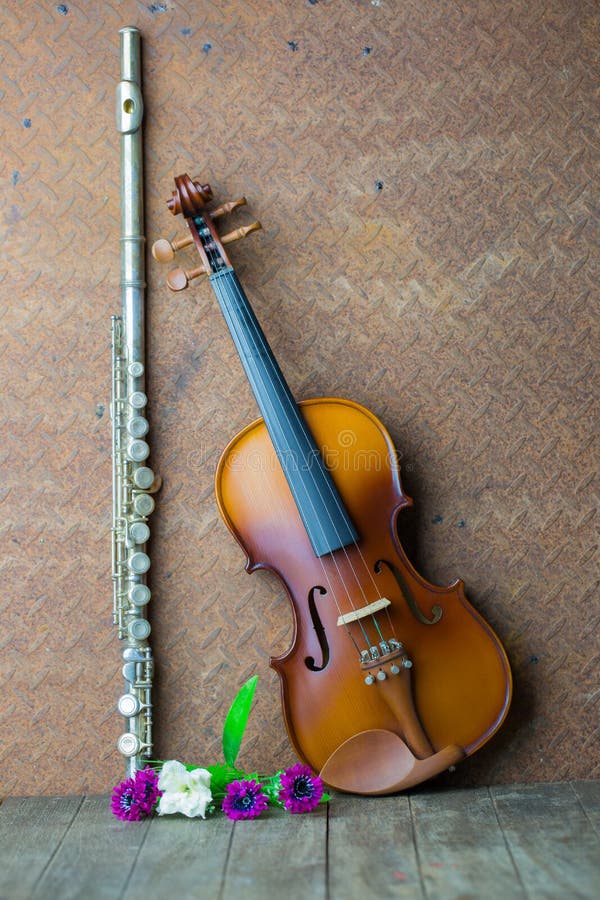 Silver flute and violin stock photo. Image of wall, artistic 64584608