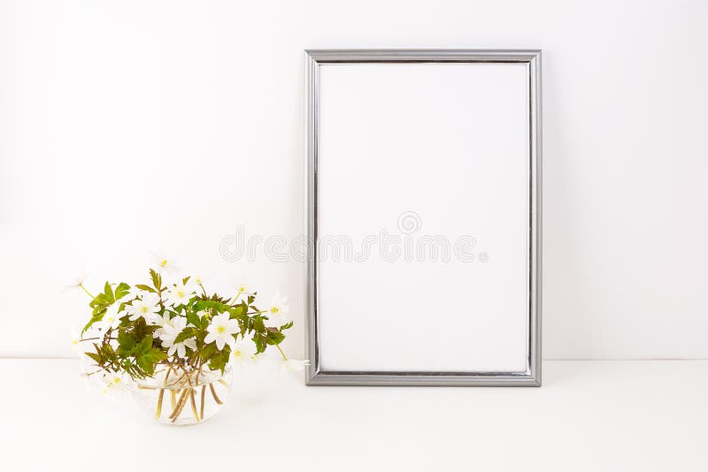 Silver frame mockup with Rue Anemone flowers stock photography Silver frame mockup with Rue Anemone flowers stock photography