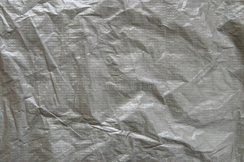 Silver gray plastic film with embossed dots background royalty free stock photo