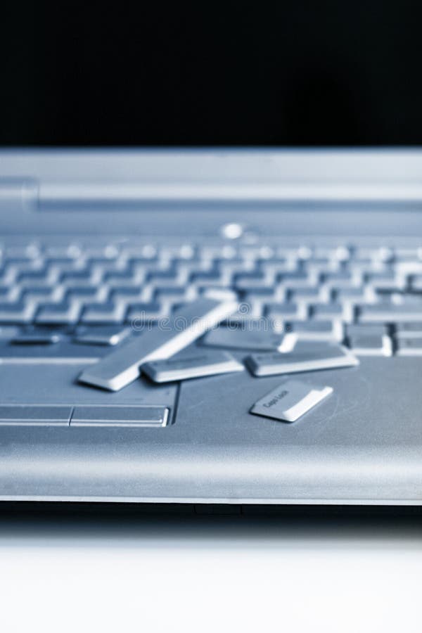 Silver Laptop with Broken Keyboard. a Closeup Picture of Part of