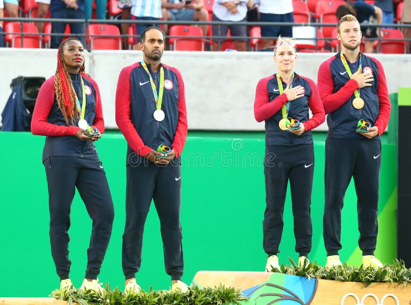 Silver medalists R.Ram and V. Williams (L) and champions Mattek-Sands and J.Sock of USA during medal ceremony stock image Silver medalists R.Ram and V. Williams (L) and champions Mattek-Sands and J.Sock of USA during medal ceremony stock image