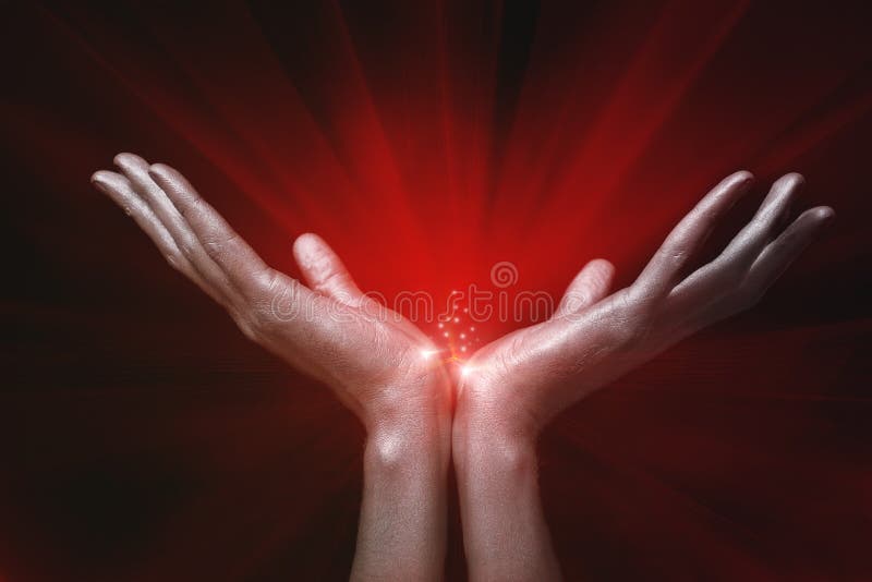 Silver men s hands holding red magic glow