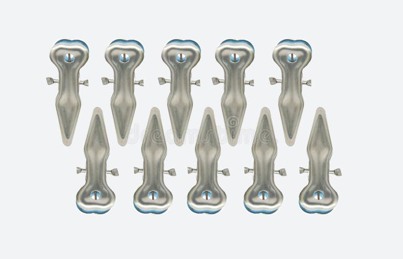 Silver metal clip for use in fastening or fixing clothes in the clothesline or in the closet, white background stock photo Silver metal clip for use in fastening or fixing clothes in the clothesline or in the closet, white background stock photo