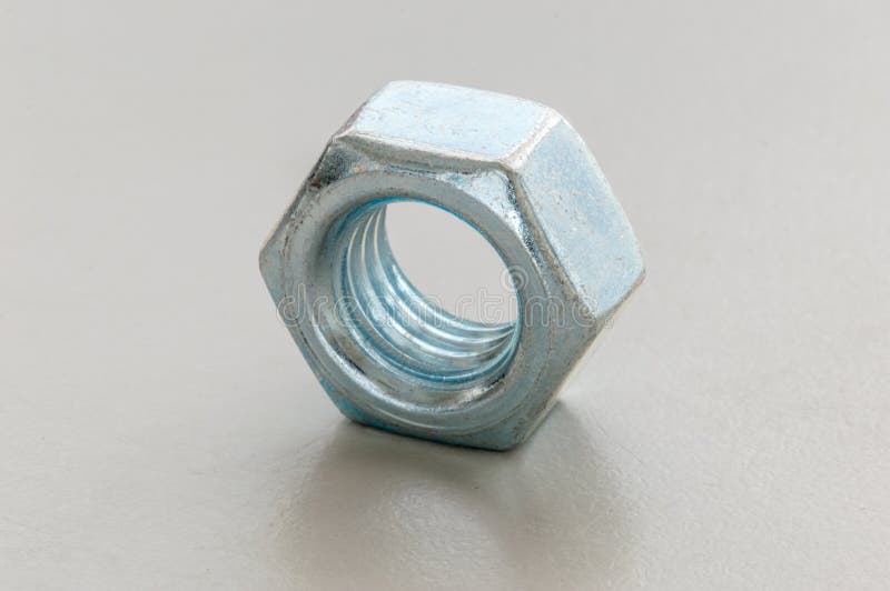 Silver Metal Nut. Nut is a Type of Fastener with a Threaded Hole Stock