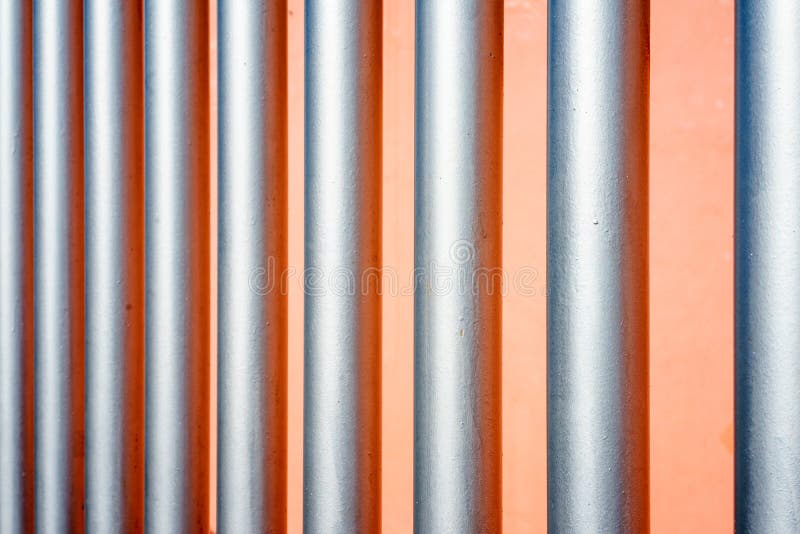 Silver metal pipe abstract background with a repetitive pattern royalty free stock photos